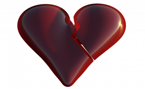Shiny red broken heart with a crack in the center, symbolizing heartbreak or emotional pain.