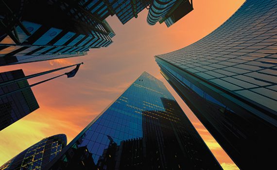 Skyscrapers against a vibrant sunset sky, showcasing modern architecture and urban design.