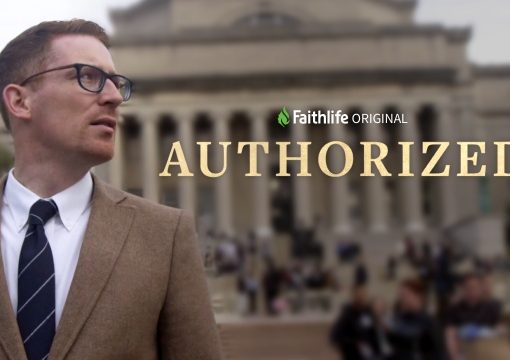 Man in suit with glasses stands outdoors, Faithlife Original: Authorized text over a blurred crowd and building background.