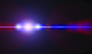 Abstract blue and red light beams intersecting on a dark background.