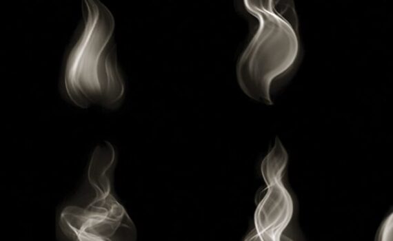 Abstract smoke shapes floating on a dark background, creating a mystical, artistic pattern.